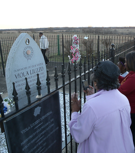 People visit the Viola Liuzzo memorial on the side of U.S. Highway 80 on March 7, 2015, in Lowndes County, Ala.
